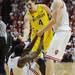 Michigan freshman Mitch McGary offers to give a hand to Indiana junior Victor Oladipo as sophomore Cody Zeller helps him up during the second half at Assembly Hall on Saturday, Feb. 2 in Bloomington, Ind. Melanie Maxwell I AnnArbor.com